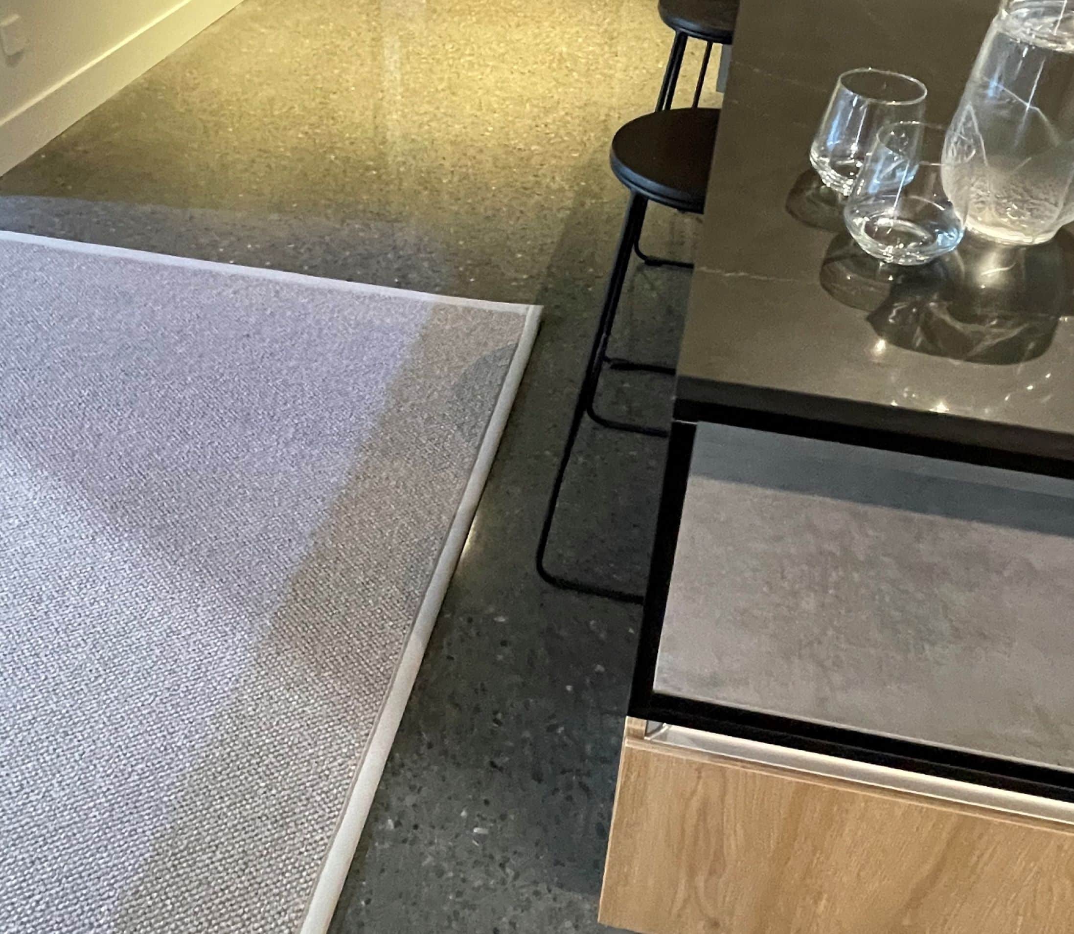 Rugs for all christchurch. Otapiri wool area rug that is placed on the floor near barstools and counter. The materials used in making the rug is with Wools of New Zealand. Wools of New Zealand Rugs