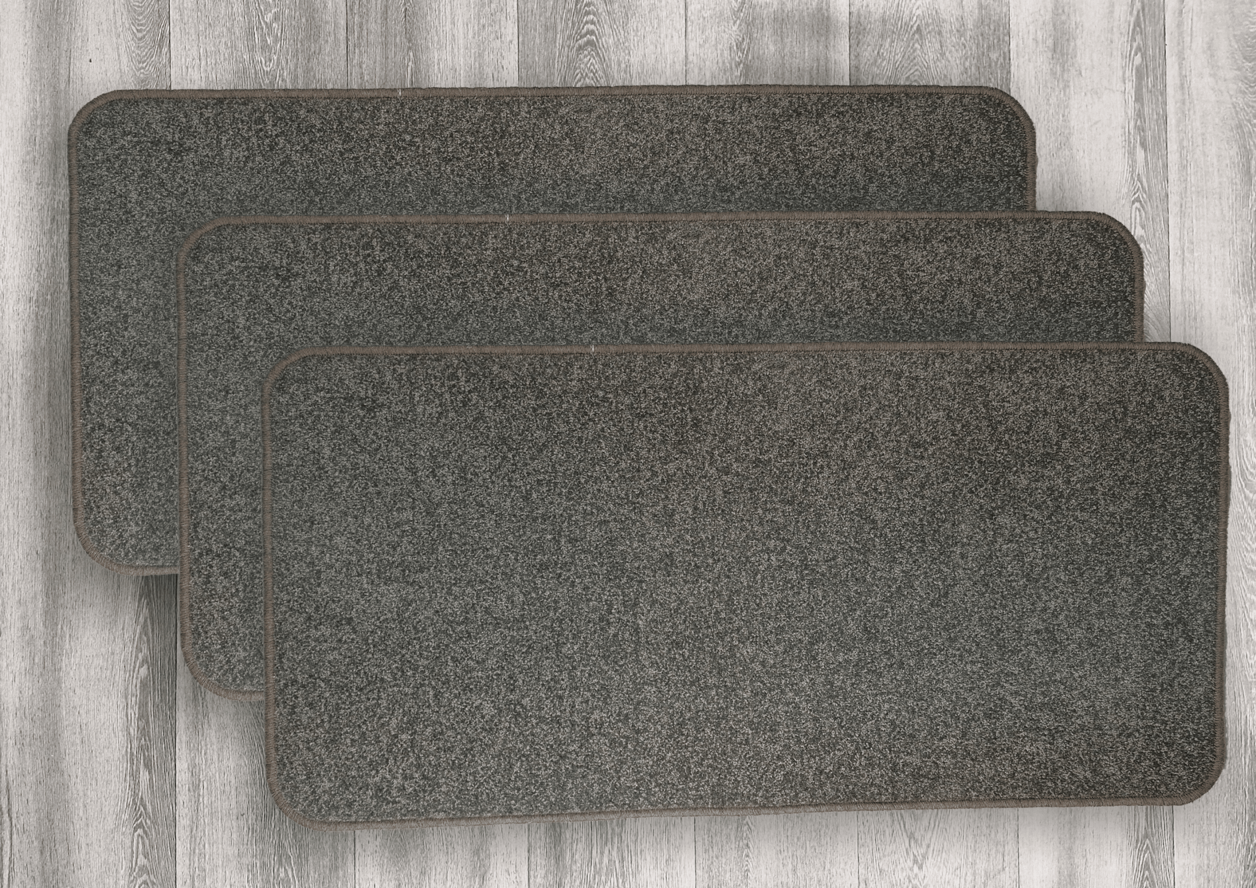 multiple stacks of wool scatter mats. 60 x 120 cm